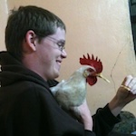 Michael with a chicken in Cabañas, La Paz, Honduras
